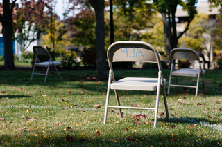 Oct. 6: Thirty-five chairs, one for each SU student killed in the bombing of Pan Am Flight 103, rest on the grass outside the Hall of Languages. Although most of the annual Remembrance Week ceremonies were cancelled due to COVID-19, SU still set up the chair display in honor of those lost.