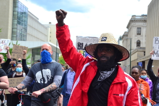 June 13: Dramar Felton raises his fist and marches in support of Last Chance for Change, a movement in Syracuse that marched for 40 consecutive days to protest racism and police brutality.