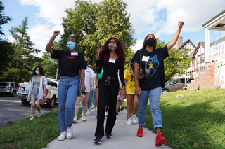 Aug. 28: Justine Hastings (center), Student Association president, leads SU students in a march against racism and police brutality. SA organized the march and other events in solidarity with the March on Washington.