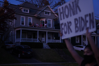 Nov. 8: Outside of her house on Euclid Avenue, Rachel Hayashi holds a sign that reads 